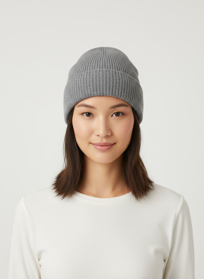 A dark grey, ribbed cashmere beanie hat.