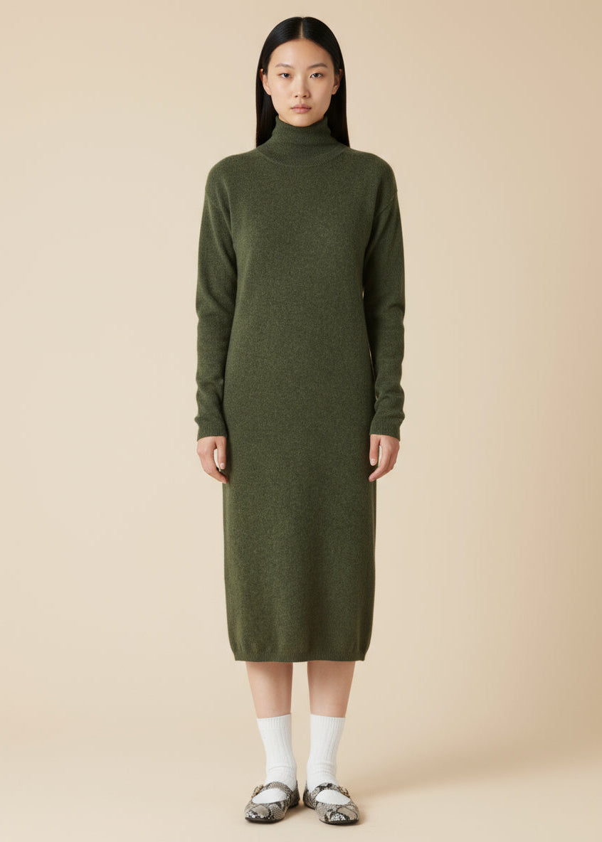 Woman wearing a green dress with a high collar