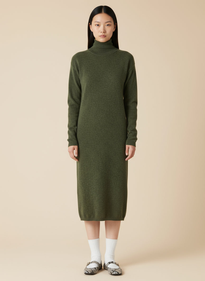 Woman wearing a green dress with a high collar