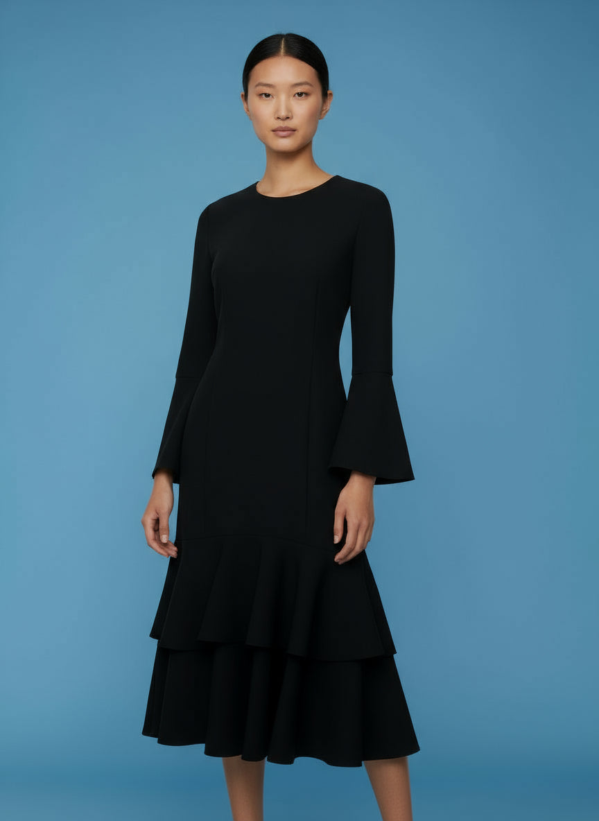 A black long-sleeved knee-length dress with a flared design.