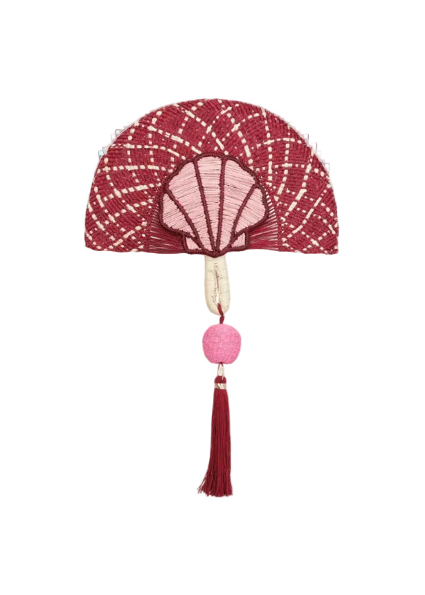 Decorative wall hanging with red and pink shell design on a white background
